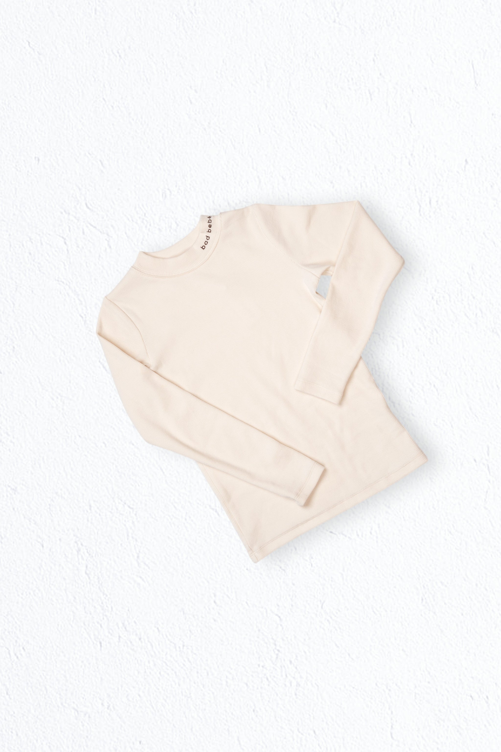 ON REPEAT RIB TURTLENECK - BONE